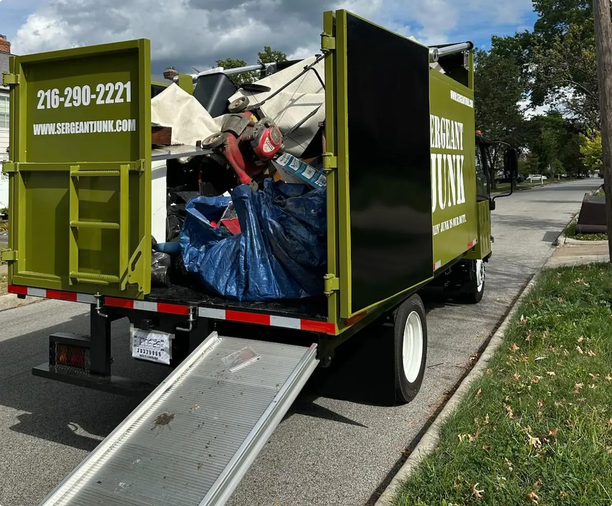 Sergeant Junk team loading junk into truck in Cleveland Ohio neighborhood